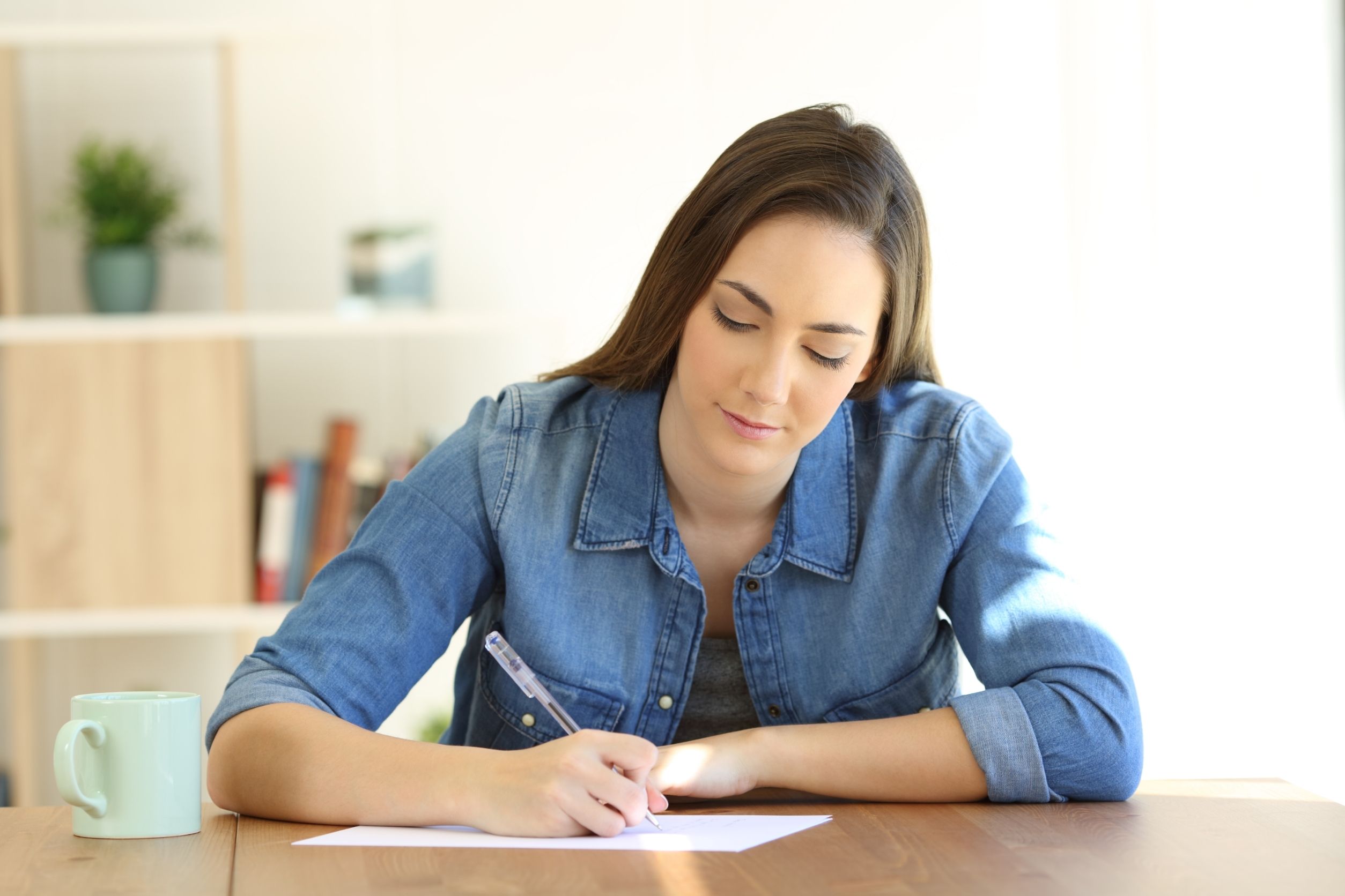 woman working on handwritten marketing letters