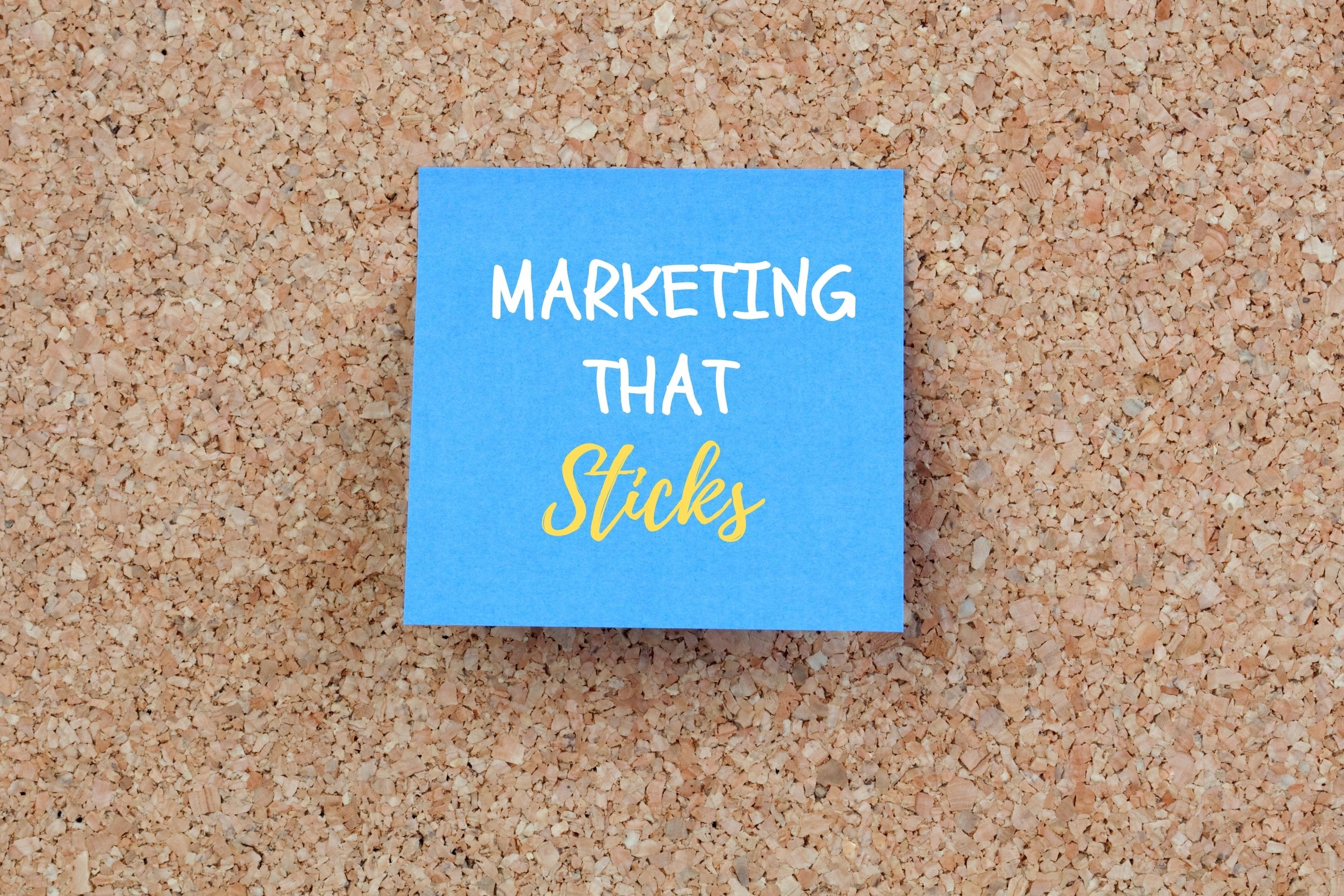 blue post it note with message that says marketing that sticks