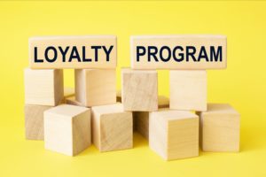 Loyalty program text on wooden blocks